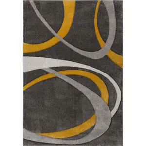 Okrově žluto-šedý koberec 120x170 cm Elude Orb – Flair Rugs